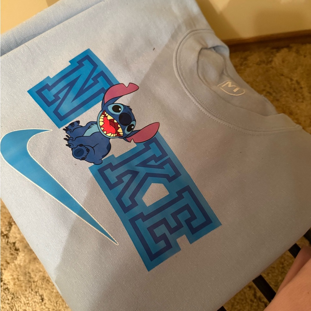 Nike Light Blue Sweatshirt with Stitch Graphic